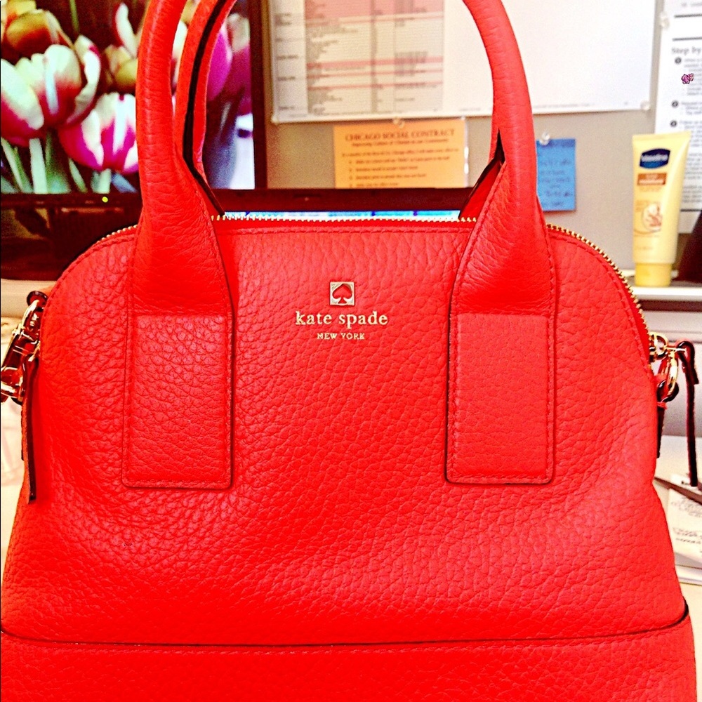 Orange Kate Spade Satchel w striped lining